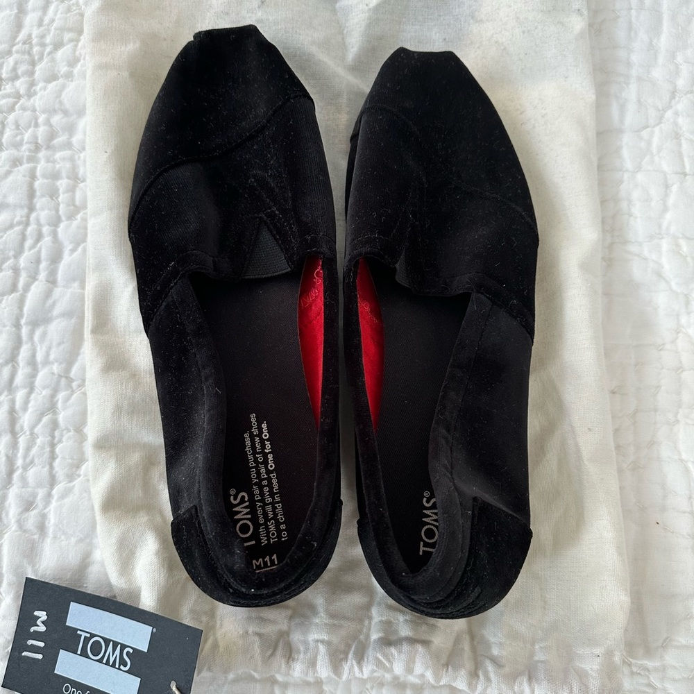 Limited addition Tom’s size 11 black satin  moccasins. Brand new. Never worn.